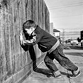 Boy looking through peephole, San Francisco Fred Lyon.png